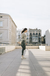 Young woman doing workout on terrace - JPF00343