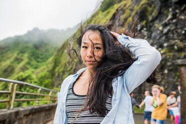 Woman with windswept hair, Nu‘uanu Pali Lookout, Oahu, Hawaii - ISF20511