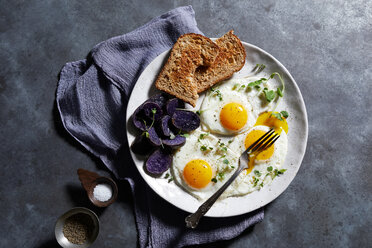 Breakfast plate of eggs and toast, overhead view - CUF48625