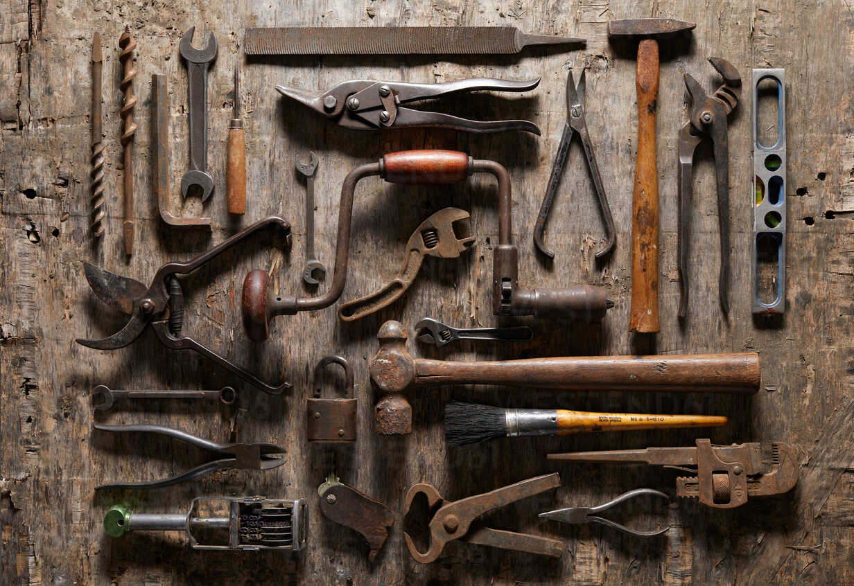 Variety of vintage hand tools on wood, overhead view stock photo