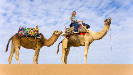 Woman on camel ride - CUF48806