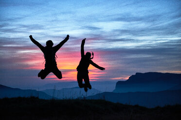 Hikers jumping for joy, Manigod, Rhone-Alpes, France - CUF48878
