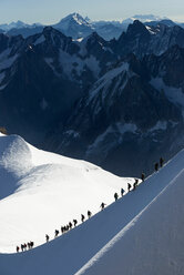 Mountain climbers on descent in distance, Chamonix, Rhone-Alps, France - CUF48960