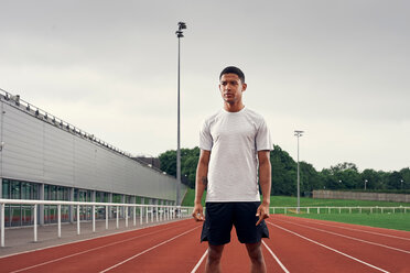 Portrait of athlete on running track - CUF49079