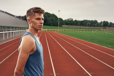 Portrait of athlete on running track - CUF49081