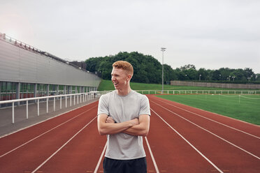 Portrait of athlete on running track - CUF49082