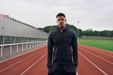 Portrait of athlete on running track - CUF49083