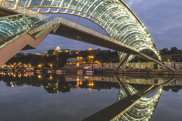 Georgia, Tbilisi, Bridge of Peace over river Kura at night - KEBF01099