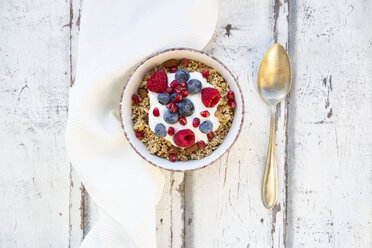 Bowl of muesli with Greek yogurt, popped quinoa, raspberries, blueberries and pomegranate seed - LVF07767