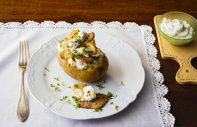 Baked potato with curd, beef and mushrooms on plate - PPXF00158