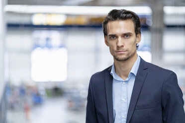 Portrait of confident businessman in a factory - DIGF05641