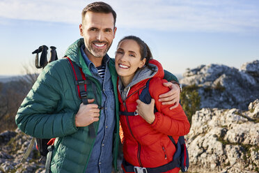 Portrait of happy couple on a hiking trip in the mountains - BSZF00935