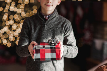 Boy holding Christmas gift - ISF20744