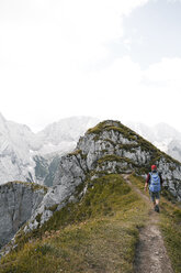 Austria, Tyrol, man hiking on mountain trail - FKF03290