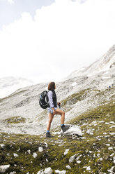 Austria, Tyrol, woman on a hiking trip in the mountains - FKF03311