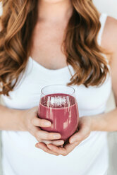 Pregnant woman with glass of smoothie - ISF20911