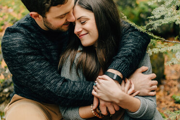 Couple hugging in forest, Tobermory, Canada - ISF20930