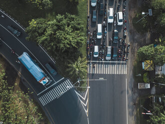 Indonesia, Bali, Sanur, Aerial view of cars, motorbikes and a truck on the road - KNTF02661