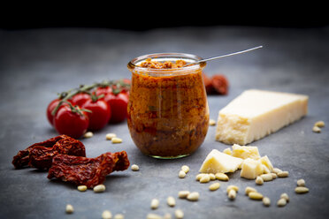 Glass of tomato pesto and ingredients - LVF07786