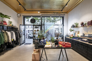 Interior of a modern concept store, displaying fashion - PESF01503