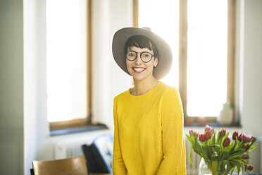 Portrait of happy stylish woman at home - SBOF01762