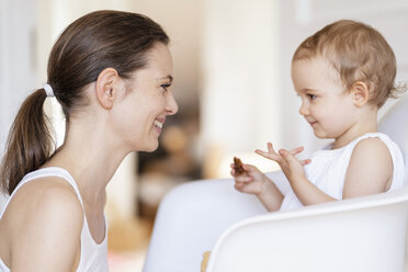 Profile of happy mother watching her little daughter - DIGF05858