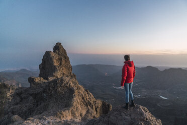 Spain, Gran Canaria, Pico de las Nieves, back view of woman looking at view - KKAF03122