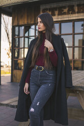 Fashionable teenage girl wearing black coat - ACPF00466