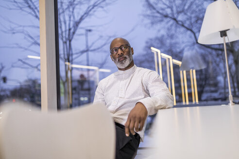 Portrait of pensive mature businessman - FMKF05382