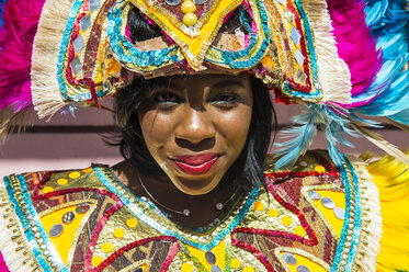 Bahamas, Nassau, Woman posing in a colorful carneval costum - RUNF01295
