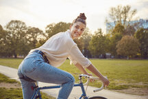 Serious woman on bike in skate park - a Royalty Free Stock Photo from  Photocase