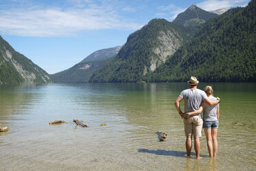 Germany, Bavaria, Koenigssee, couple standing in lake - DLF00027