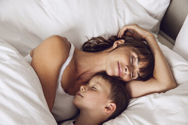 Mother and son cuddling in bed - MCF00042