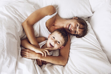 Mother and son cuddling in bed - MCF00045