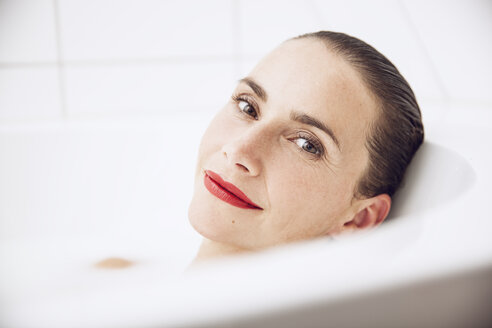 beautiful woman relaxing in a milk bath - MCF00056