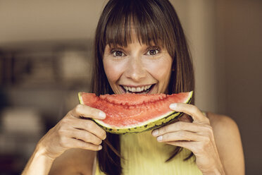 Beautiful woman eating slice of watermelon - MCF00068