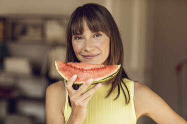 Beautiful woman eating slice of watermelon - MCF00070