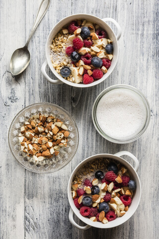 Cereals with almond milk, nuts and berries, vegan stock photo