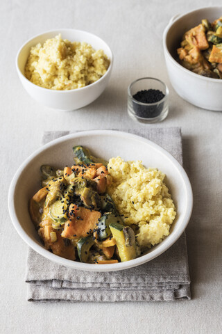 Millet with creamy vegetables, courgette, sweet potatoes and mushrooms stock photo