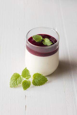 Panna cotta with berry sauce stock photo