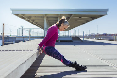 Sportive mature woman during stretching - GRSF00079