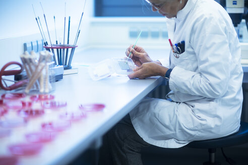 Lab technician preparing sample - SGF02259