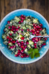 Fork of bulgur wheat salad with cucumber, herbs, pomegranate seed and parsley - LVF07834