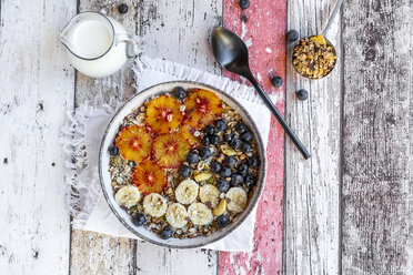 Cereals with banana, blueberries, blood orange, coconut flakes and milk - SARF04122