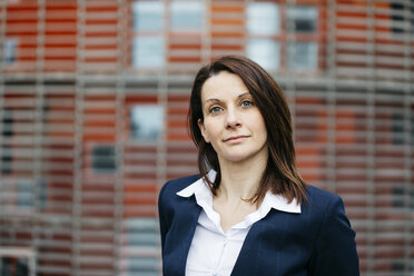 Portrait of a confident businesswoman outside office building in the city - JRFF02725