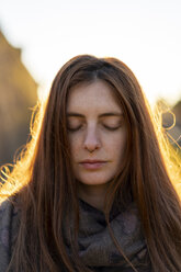 Portrait of freckled young woman with nose piercing in autumn - AFVF02473