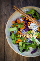 Glass noodle salad with pak choi, carrot, red cabbage and peanuts, from above - LVF07844