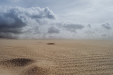 Spain, Tarifa, cloudy sky over sand dune - OCMF00296