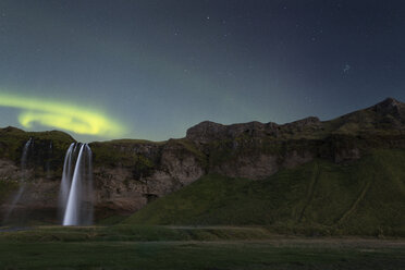 Scenic view of waterfall amidst mountain against sky at night - CAVF60651