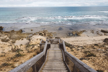 Scenic view of sea with wooden steps at beach - CAVF60672